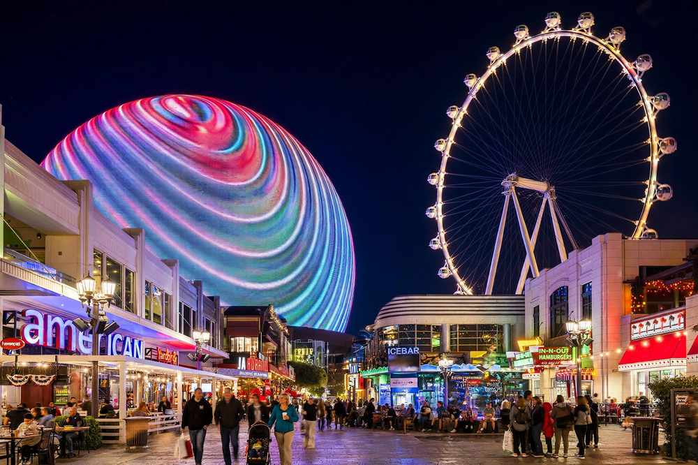 The Las Vegas Strip in Paradise, Nevada lit up at night with resort towers and fountains